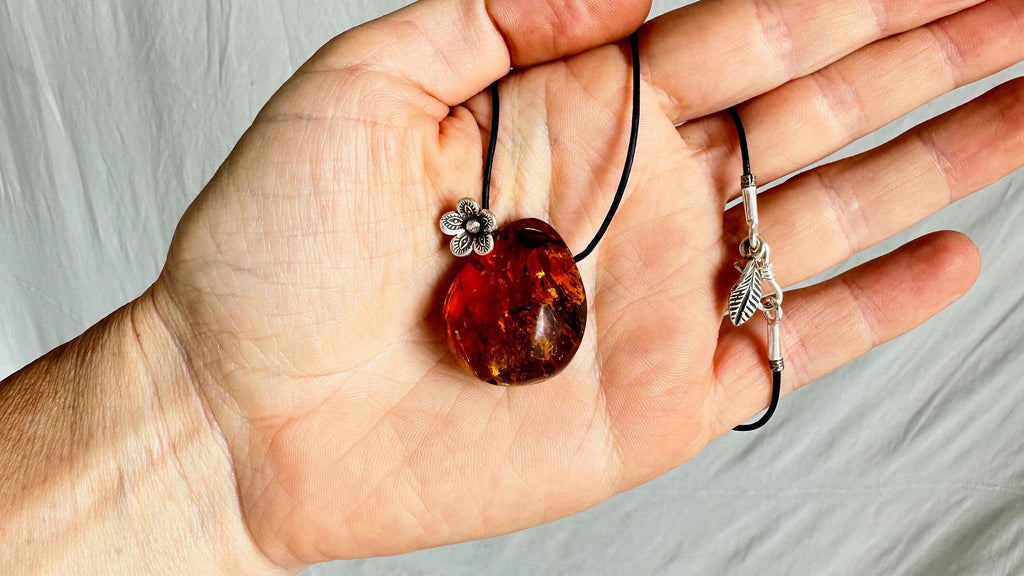 Large Amber Pendant on a Leather Cord. 1426